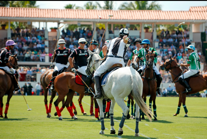 Polo players competing on horseback during a professional polo match in the USA showcasing elite sports and luxury polo tourism.